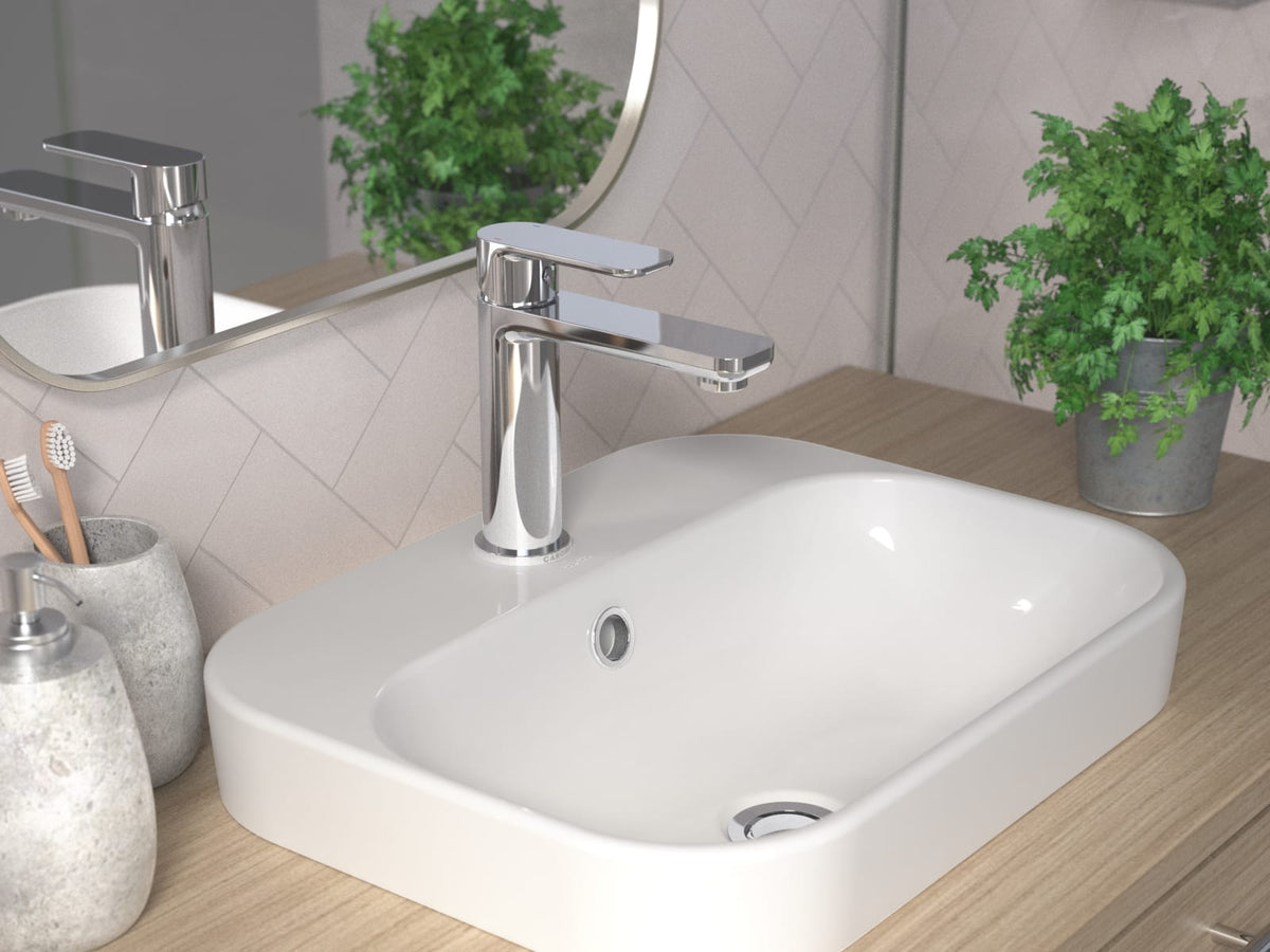 Chrome basin mixer installed on a timber vanity with an inset basin