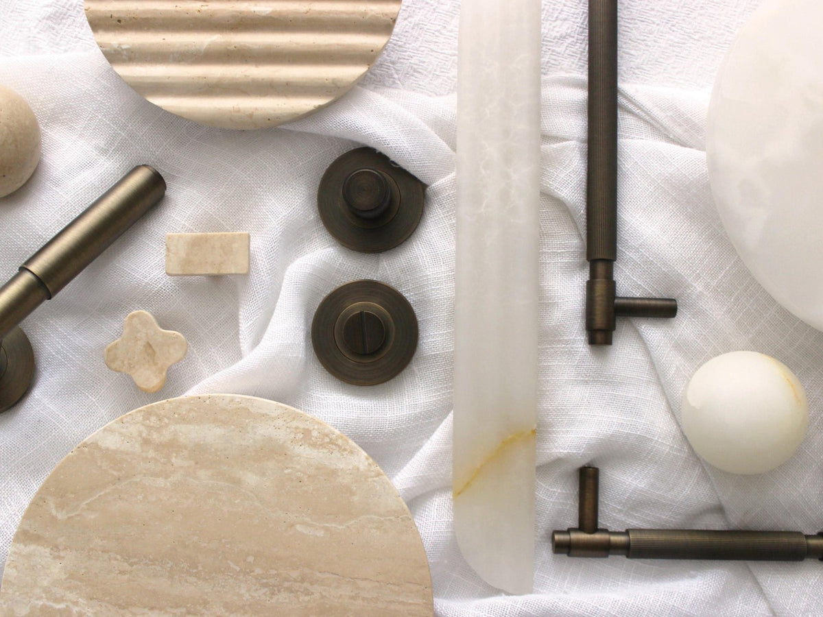 Zephra solid steel and natural stone door and cabinet hardware styled on linen