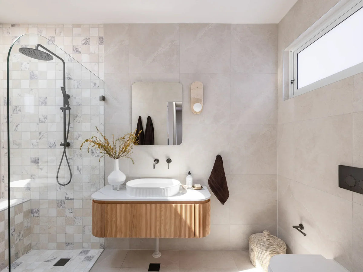 Lilyfield Luxury bathroom with stone-look porcelain walls, walk-in shower and floating timber vanity