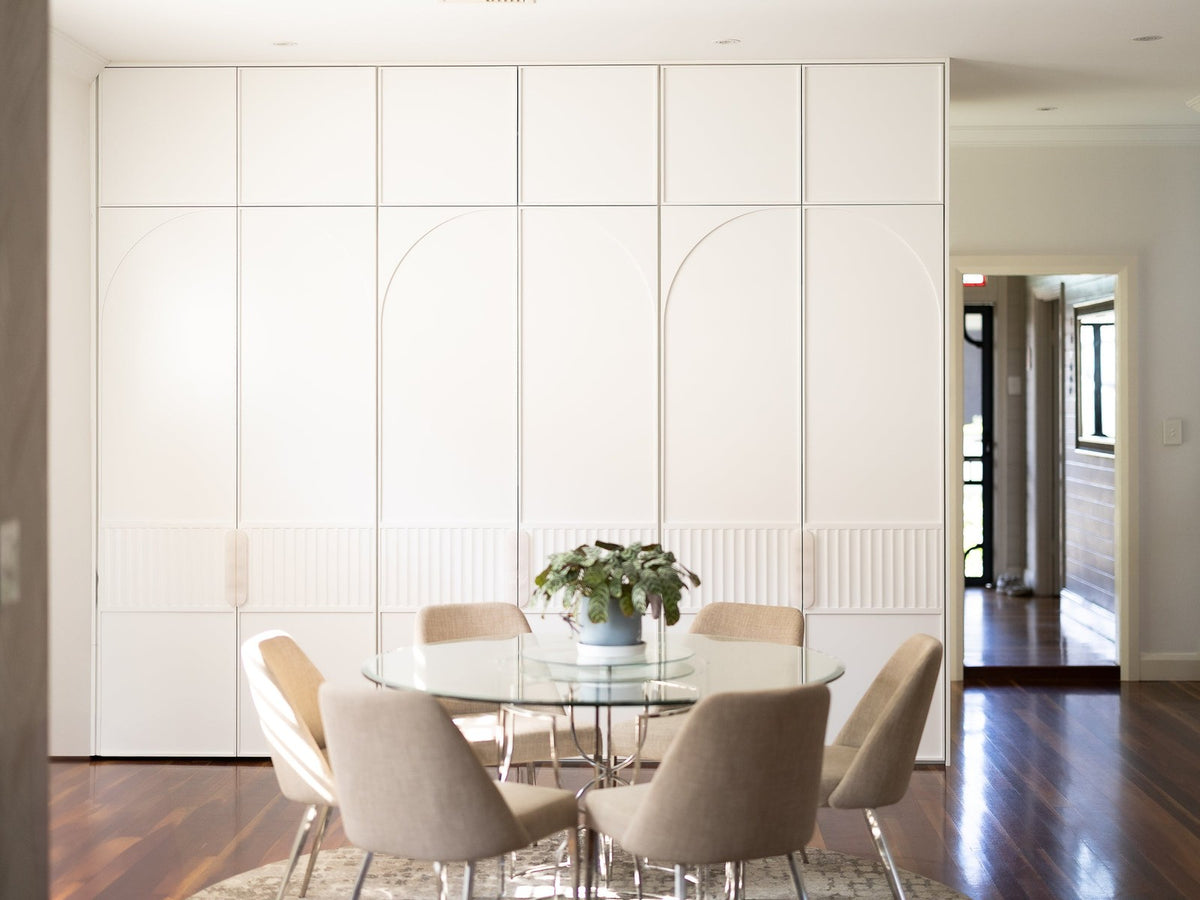 Zephra hardware in an Earlwood residence, stone cabinet pulls on fluted white joinery