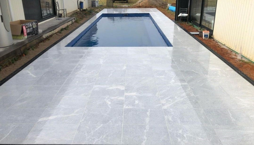 Pearl Grey Tumbled and Sandblasted Marble Tile, pool setting