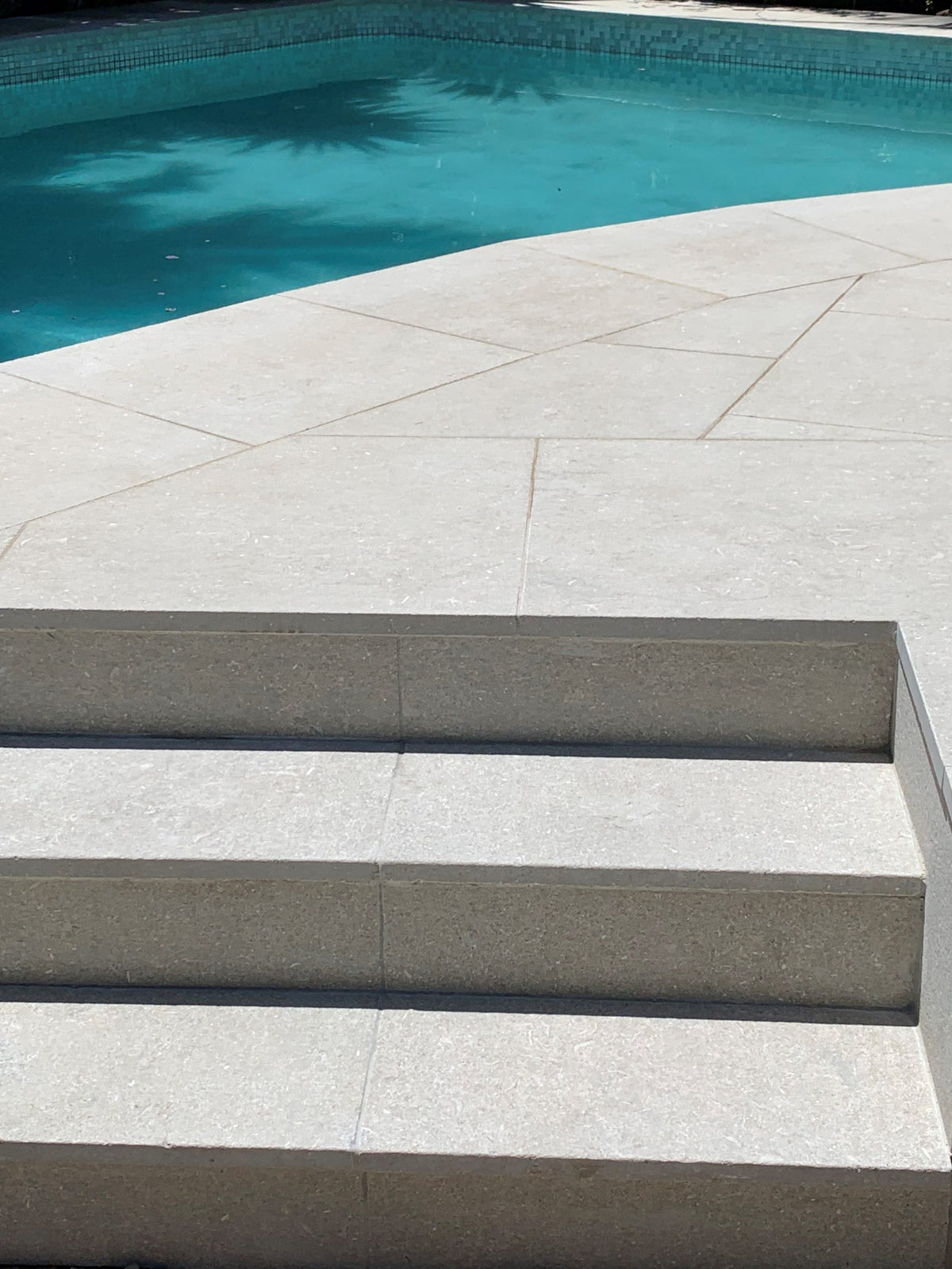 Seagrass Flamed & Tumbled Marble Tile, pool setting