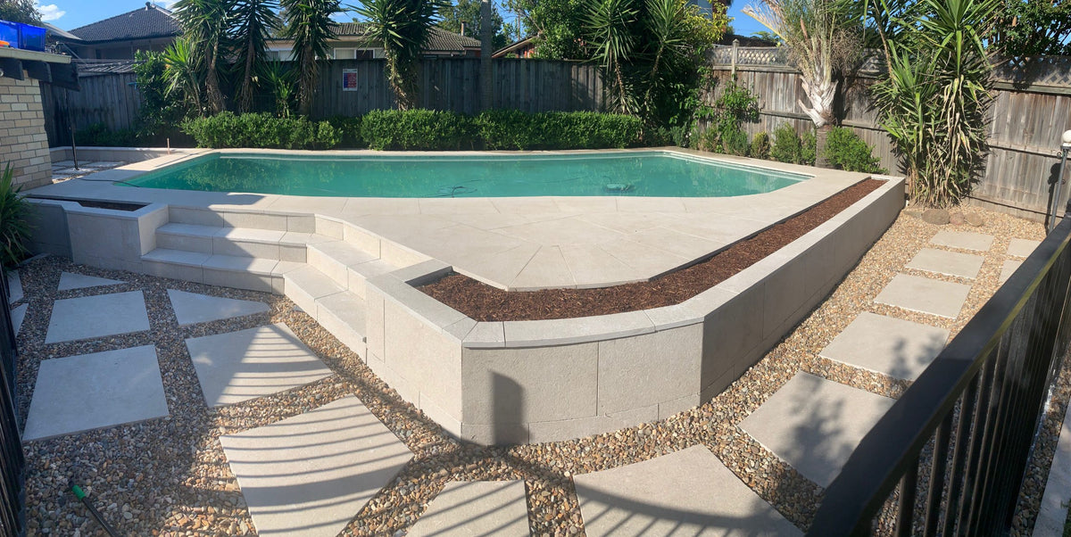 Seagrass Flamed & Tumbled Marble Tile, pool setting