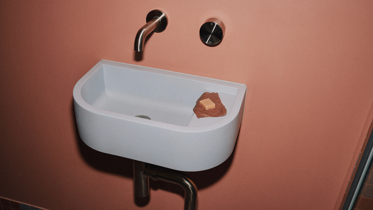 Nood Co Loop 01 Concrete Basin in Powder Blue, installed in a finished bathroom