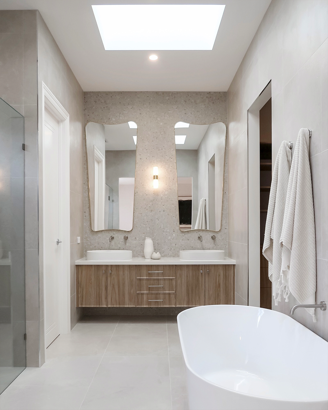 Nood Co Pill Concrete Basin in Ivory, installed in a finished bathroom