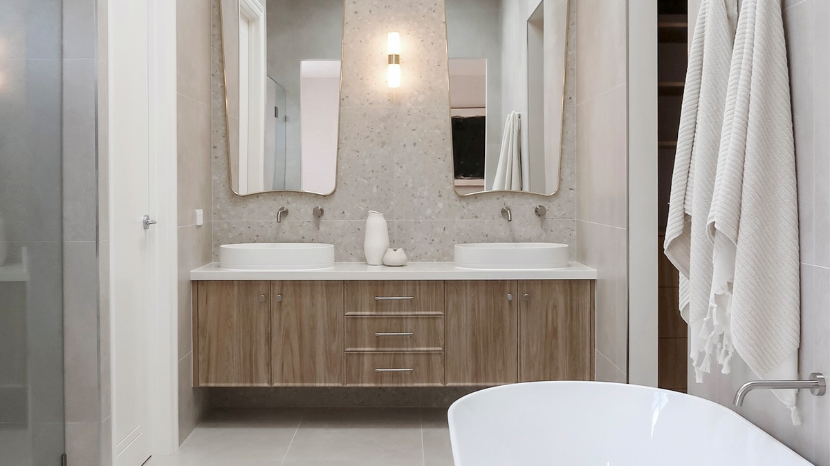 Nood Co Pill Concrete Basin in Ivory, installed in a finished bathroom
