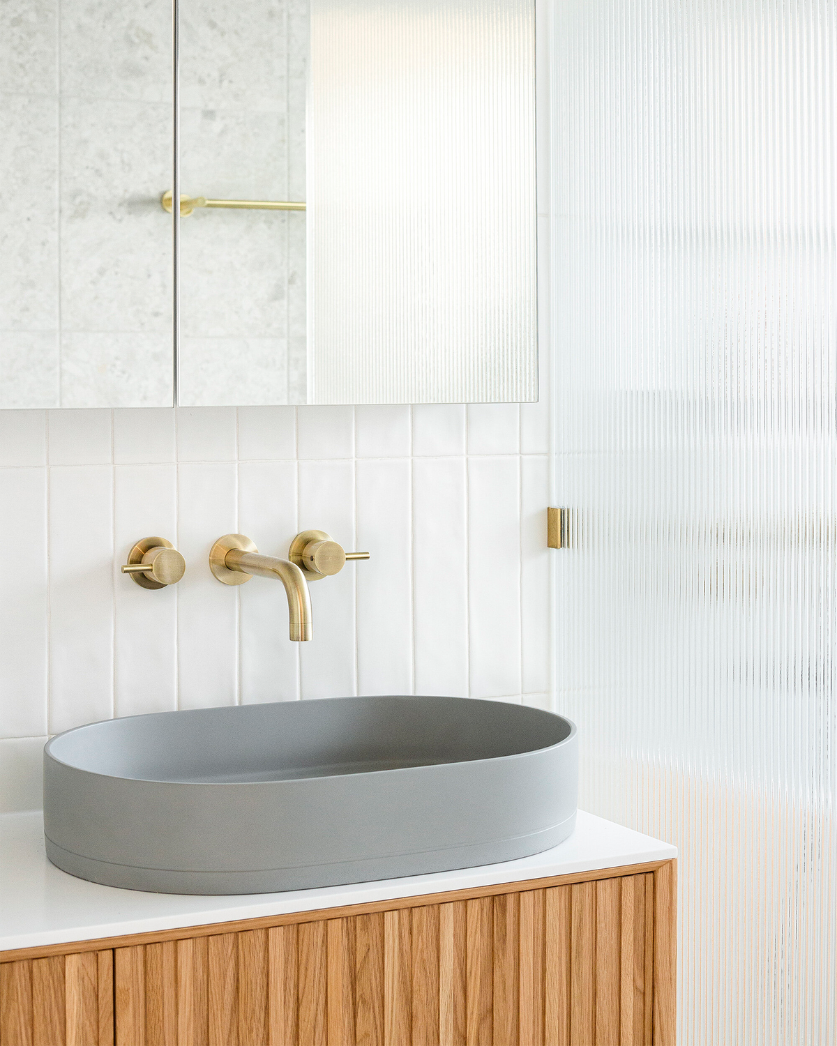 Nood Co Pill Concrete Basin in Sky Grey, installed in a finished bathroom