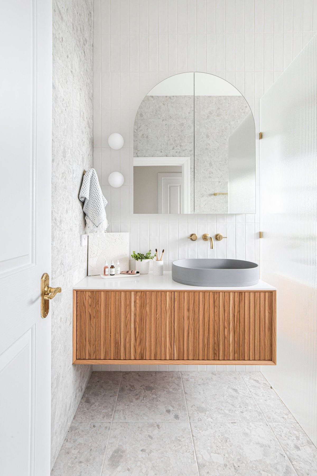 Nood Co Pill Concrete Basin in Sky Grey, installed in a finished bathroom