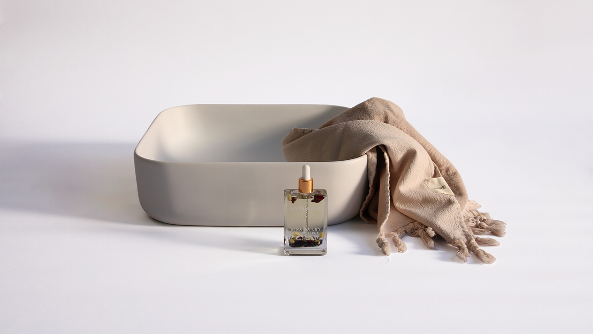 Nood Co Cube Concrete Basin in Sky Grey, installed in a finished bathroom