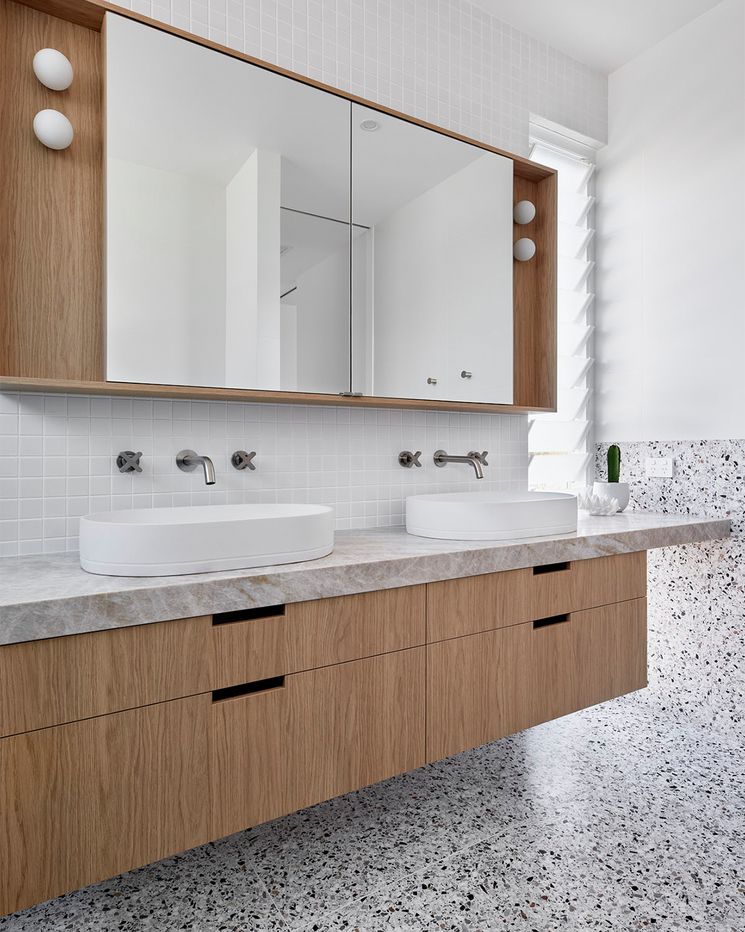 Nood Co Pill Concrete Basin in Ivory, installed in a finished bathroom