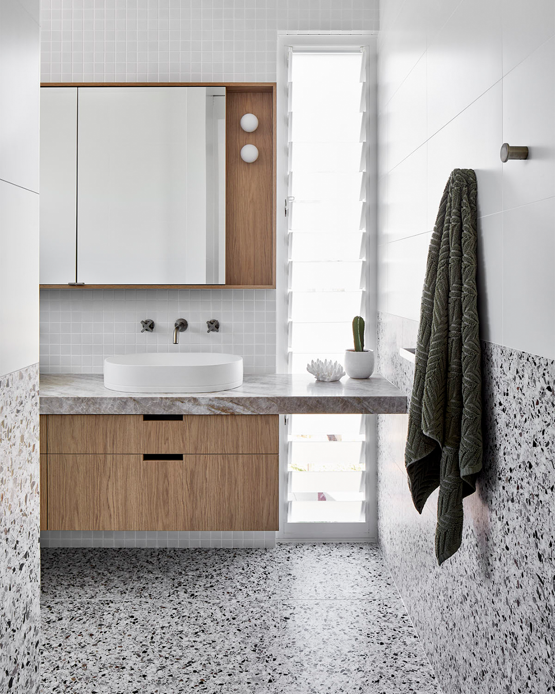 Nood Co Pill Concrete Basin in Ivory, installed in a finished bathroom