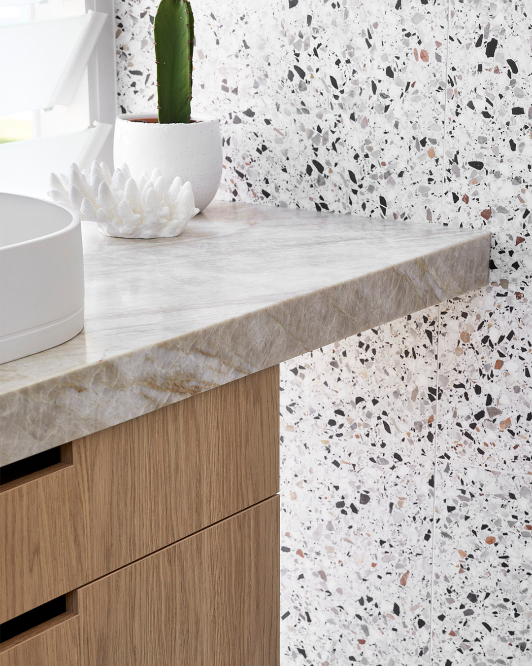 Nood Co Pill Concrete Basin in Ivory, installed in a finished bathroom