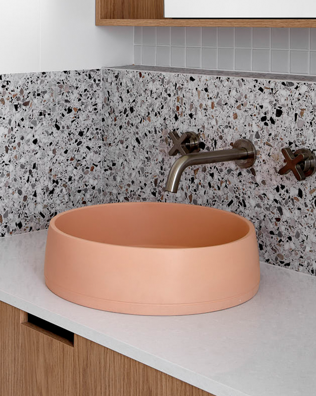 Nood Co Funl Concrete Basin in Pastel Peach, installed in a finished bathroom