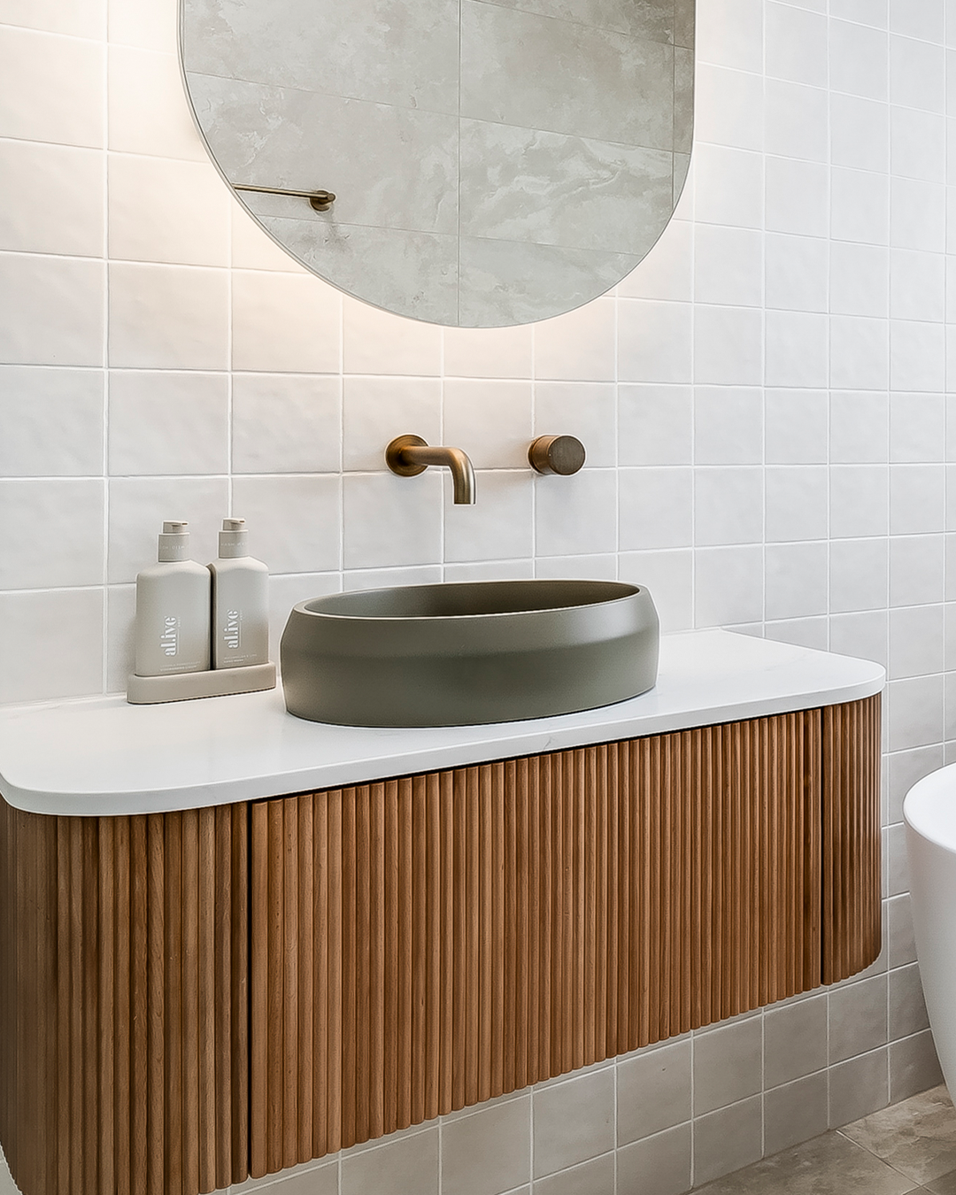 Nood Co Prism Circle Concrete Basin in Olive, installed in a finished bathroom (2)