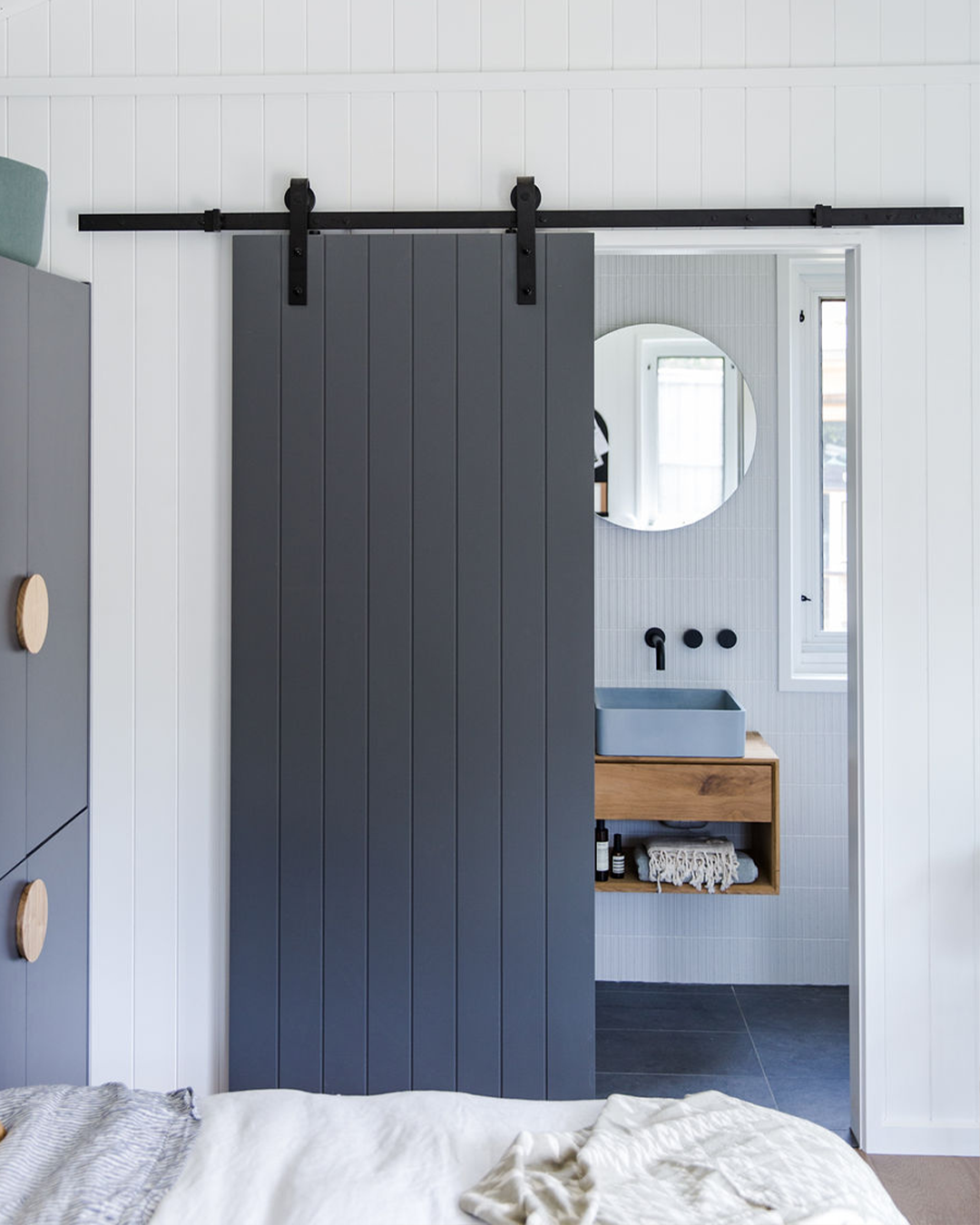 Nood Co Vesl Square Concrete Basin in Powder Blue, installed in a finished bathroom