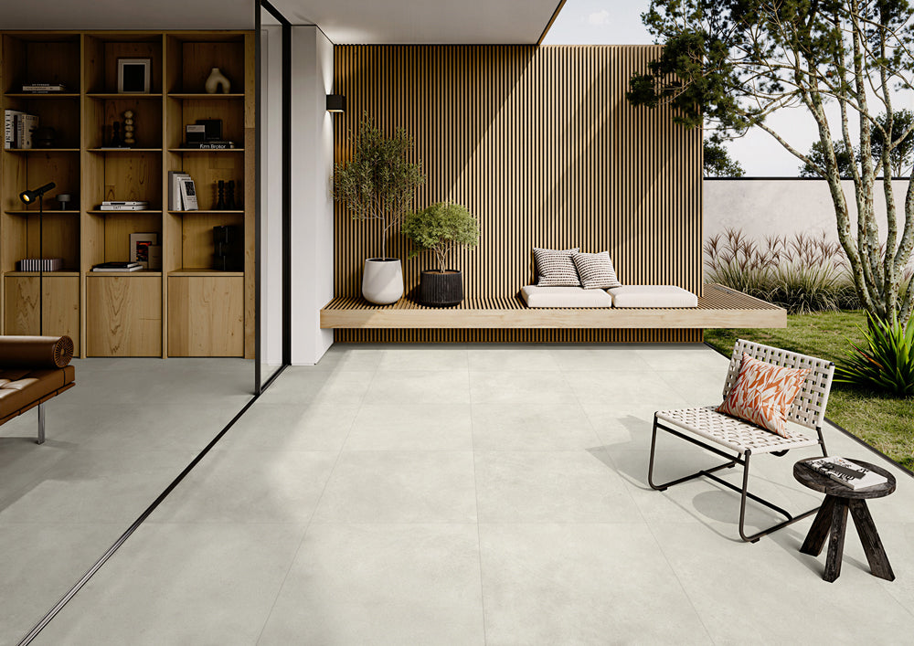 Nova Stone Ivory Porcelain Floor and Wall Tile flowing from living room to courtyard