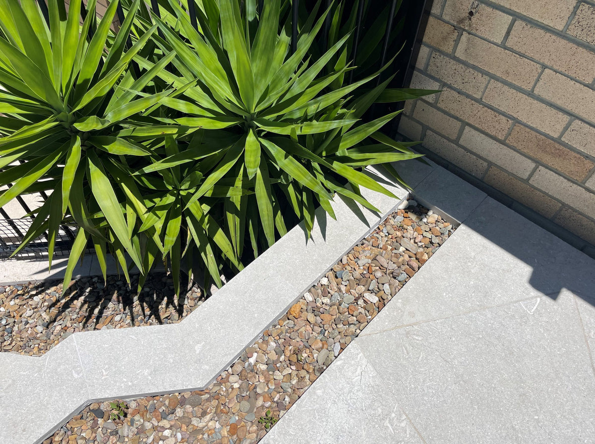 Seagrass Flamed & Tumbled Marble Tile, outdoor setting
