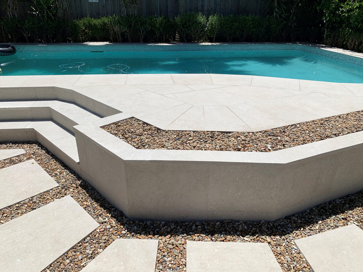 Seagrass Flamed & Tumbled Marble Tile, pool setting