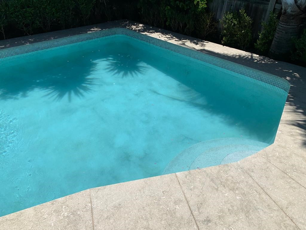 Seagrass Flamed & Tumbled Marble Tile, pool setting