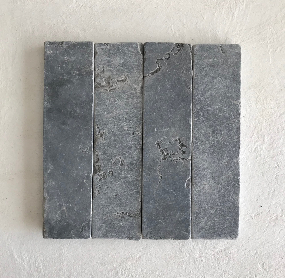 Stone Fingers Tumbled Subway Tile 50x200mm in Negrona