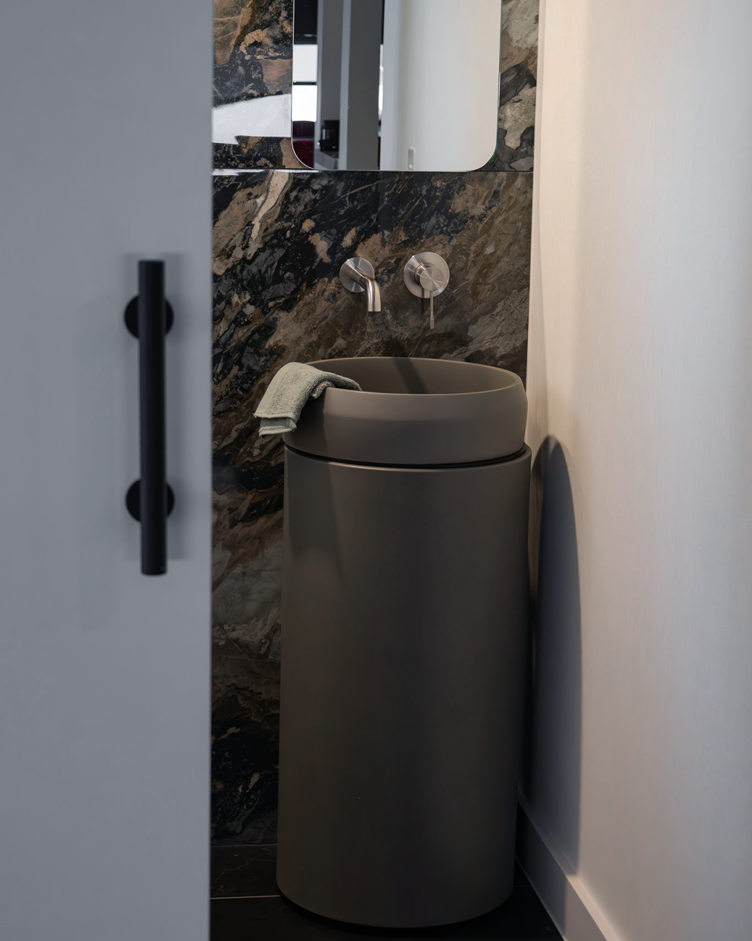 Nood Co Cylinder Prism Circle Concrete Basin installed in a finished bathroom