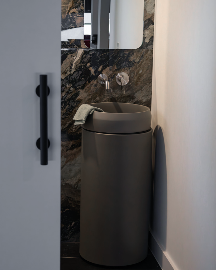 Nood Co Cylinder Prism Circle Concrete Basin installed in a finished bathroom