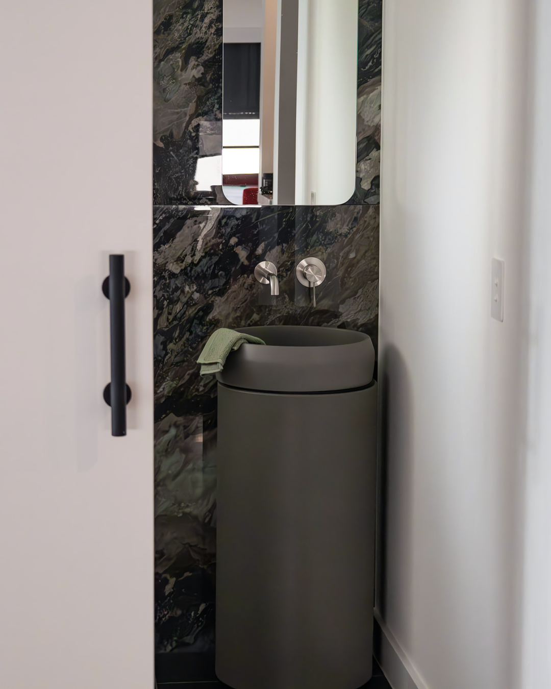 Nood Co Cylinder Prism Circle Concrete Basin in Mid Tone Grey, installed in a finished bathroom