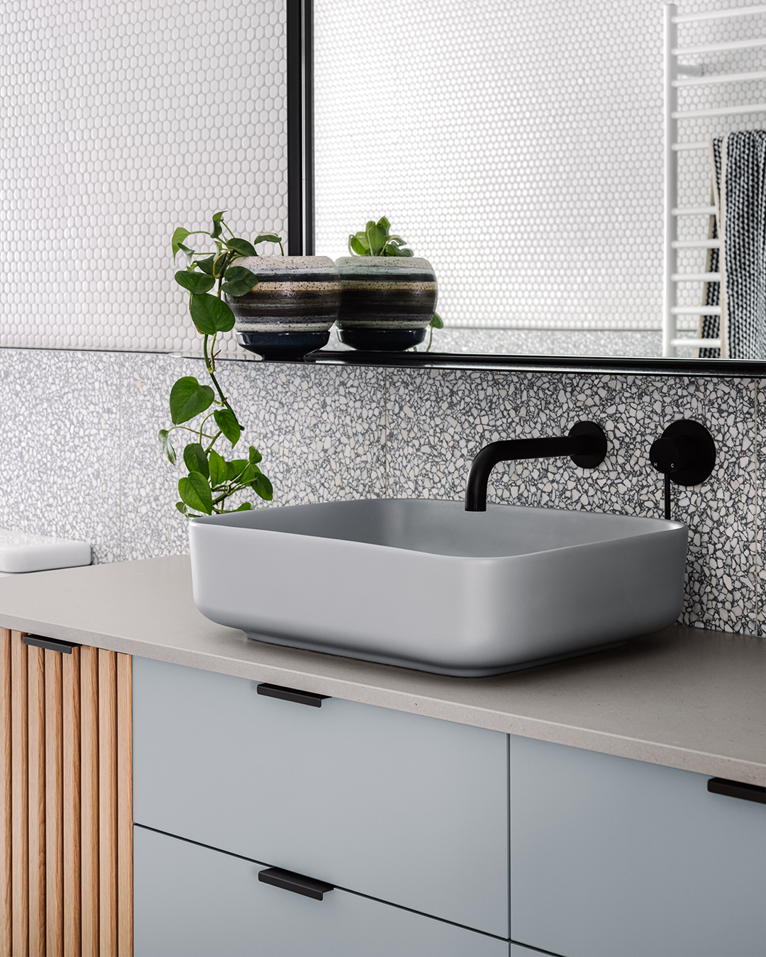 Nood Co Cube Concrete Basin in Sky Grey, installed in a finished bathroom
