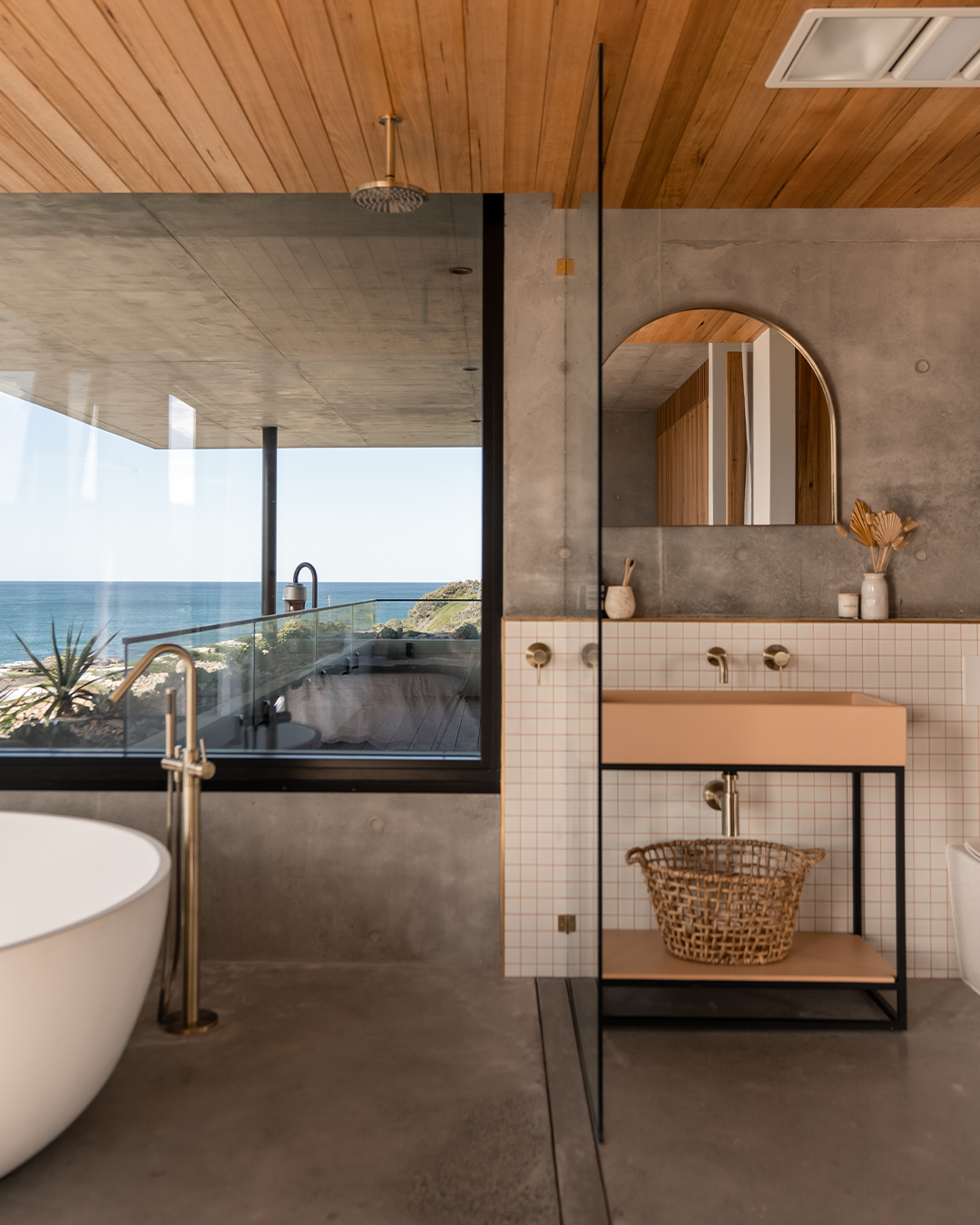 Nood Co Box Concrete Basin in Pastel Peach, installed in a finished bathroom