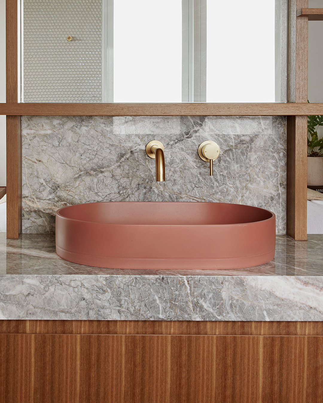 Nood Co Pill Concrete Basin in Musk, installed in a finished bathroom