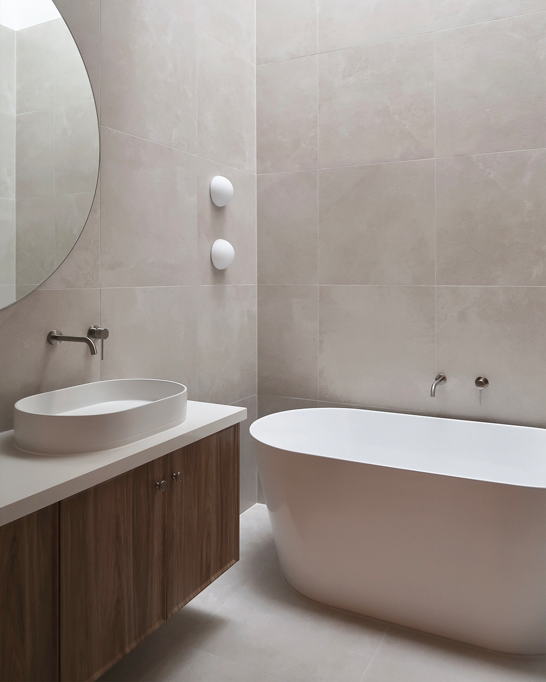 Nood Co Pill Concrete Basin in Ivory, installed in a finished bathroom