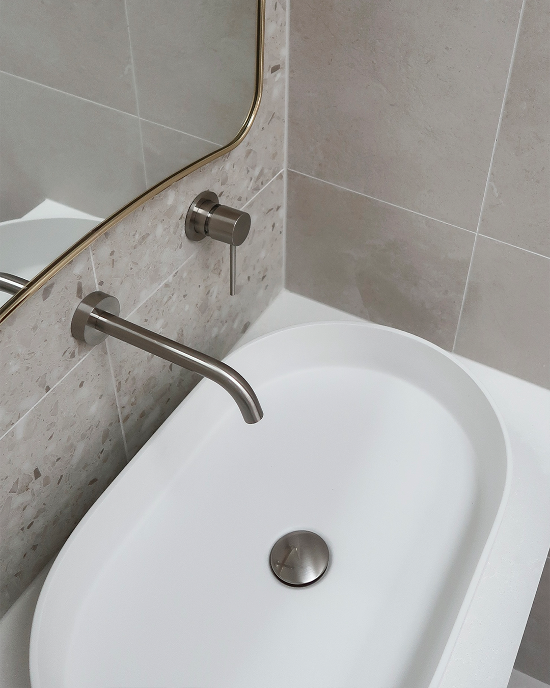 Nood Co Pill Concrete Basin in Ivory, installed in a finished bathroom