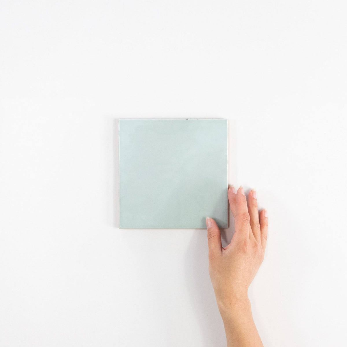 Gouache Ciel ceramic wall tile, 155 x 155 in hand