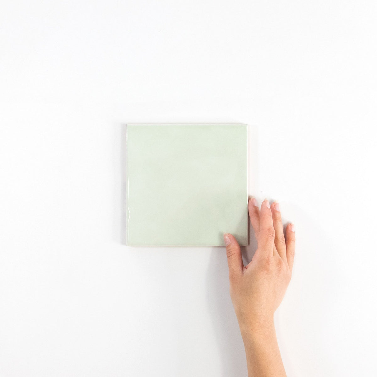 Gouache Mer ceramic wall tile, 155 x 155 in hand