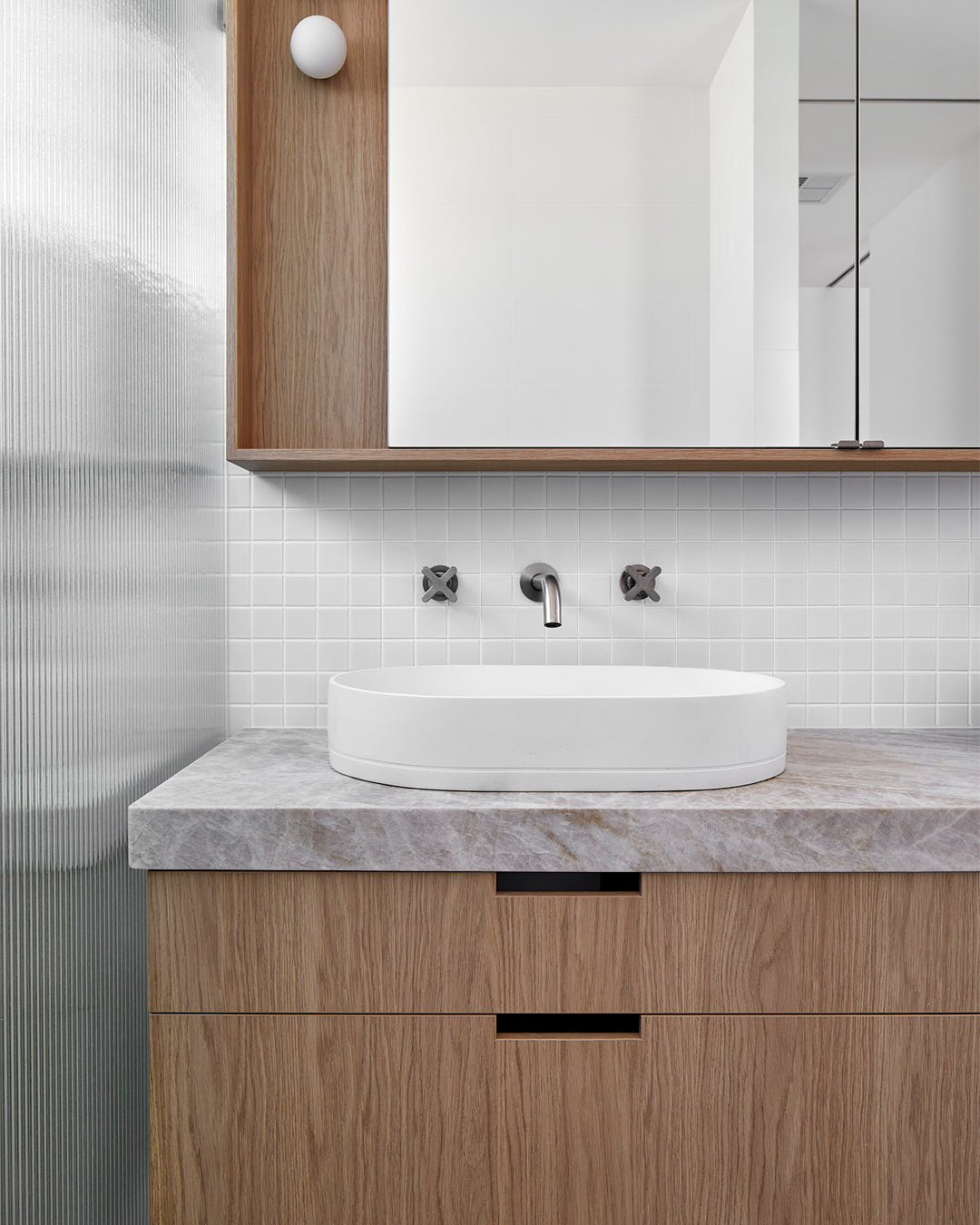 Nood Co Pill Concrete Basin in Ivory, installed in a finished bathroom