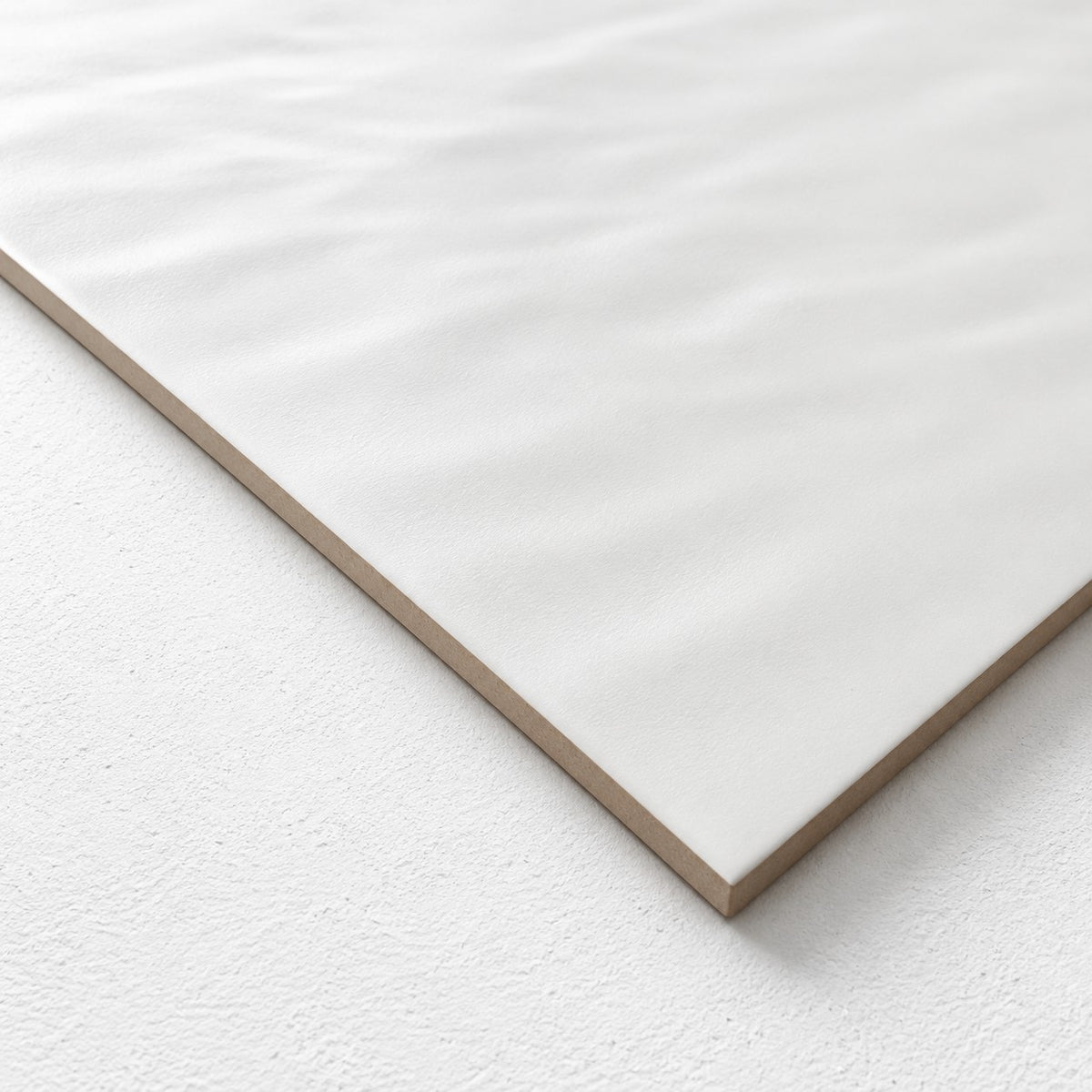 Surf Wave White Wall Tile 300x600 | Gloss & Satin Finish in Satin - close-up angle showing the soft wave and satin finish