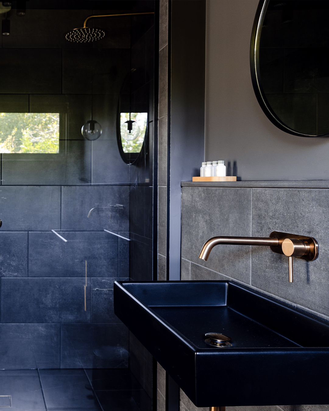 Nood Co Box Concrete Basin in Charcoal, installed in a finished bathroom