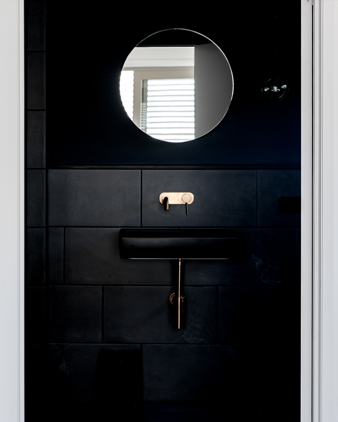 Nood Co Box Concrete Basin in Charcoal, installed in a finished bathroom (2)