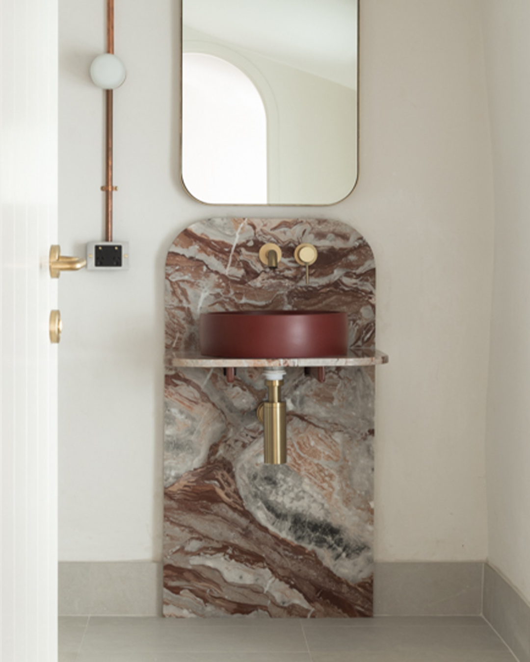 Nood Co Hoop Concrete Basin in Clay, installed in a finished bathroom